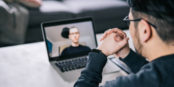 Therapist making online therapy sessions with patient.